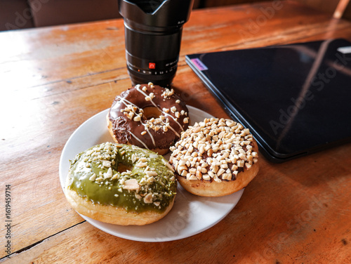 Work from cafe, accompanied by various flavor donuts, matcha, peanut and chocolate