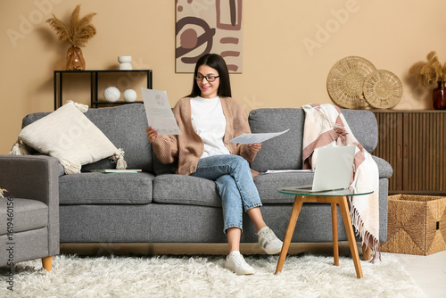 Beautiful young woman worki...