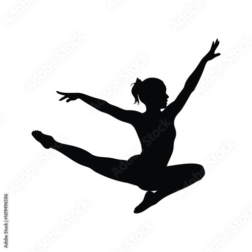 Silhouette of a female gymnast performing a leaping acrobatic move, graceful pose