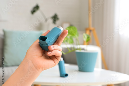 Woman holding modern inhale...