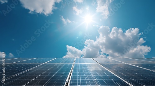 Low angle, sunlit solar panels on residential roof, vibrant blue sky, energy independence, renewable energy .