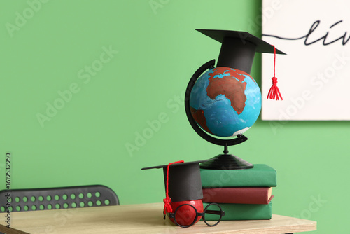 School desk with globe, app...