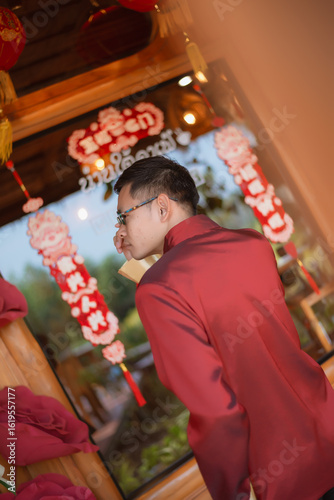 A man dressed in Chinese New Year clothing
