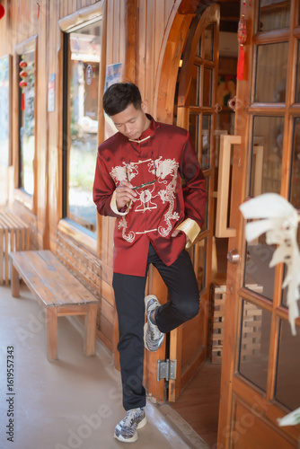 A man dressed in Chinese New Year clothing