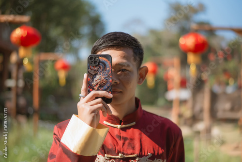 A man dressed in Chinese New Year clothing