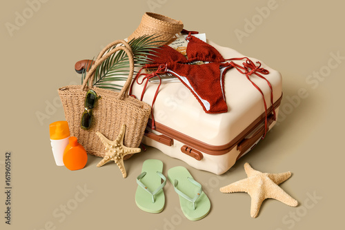 Suitcase with stylish swims...