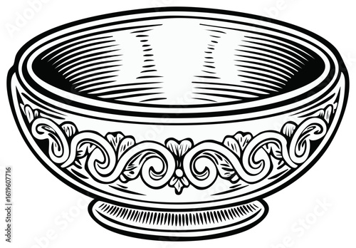 Vintage decorative bowl with ornate scrollwork in a classic engraving style