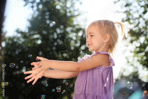 Cute little girl with soap ...