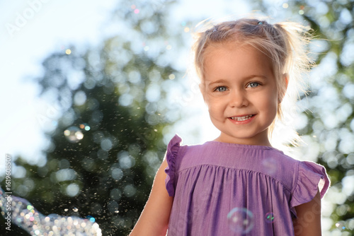 Cute little girl with soap ...