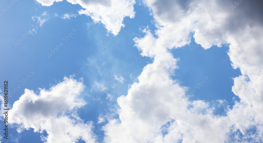 Fototapeta premium Dramatic form atmosphere of beautiful summer tropical blue sky and soft, fluffy clouds on shining and bright day. Image use for meteorology forecast background.