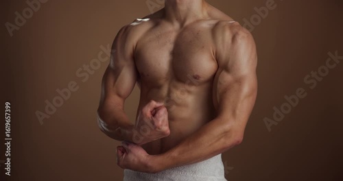 Shirtless, fitness and man in studio, muscular and energy with grooming on brown background. Topless, space and person with health, confident athlete and bodybuilding with pride, pecs and torso
