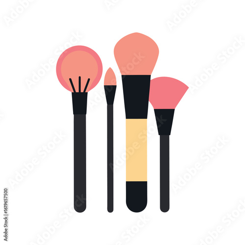 Four makeup brushes in coral and peach tones beauty