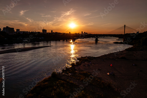 Wallpaper Mural sunset over the river with city and bridge in the background Torontodigital.ca