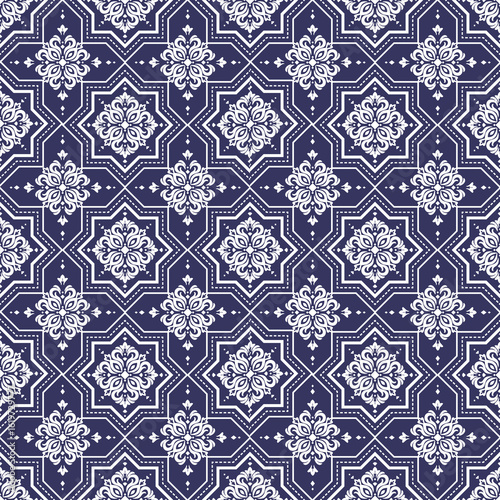 Seamless white ornamental pattern geometric stars intricate designs on dark blue background Elegant decorative tile