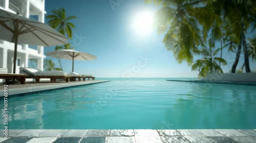 Tropical resort swimming pool view with palm trees and serene ocean backdrop