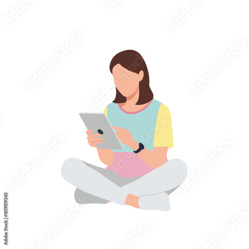 Woman using tablet for digital lifestyle while sitting cross legged on floor. This woman using tablet for online shopping and communication in her modern everyday life.