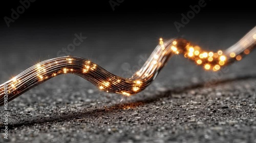 Elegant wire with twinkling lights creates a magical atmosphere on a dark surface at night
