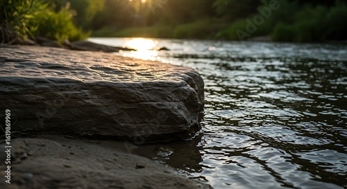 Riverbank at Sunset: Tranquil Waters and Golden Light