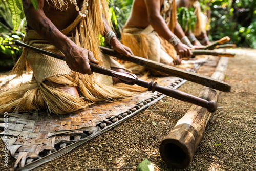 Photography Hands of warriors from Futuna, Vanuatu, beat a bamboo log in time during a customary dance