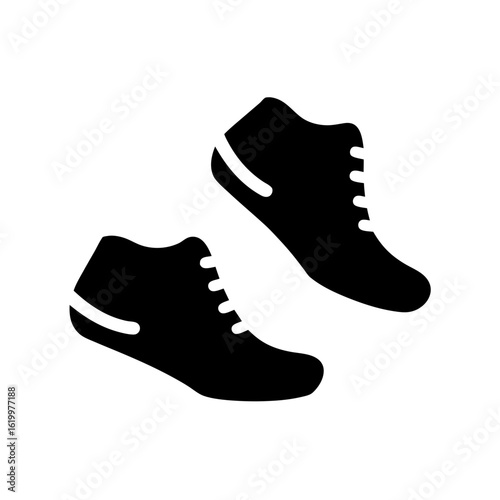Pair of stylish black casual shoes or trainers isolated on white background