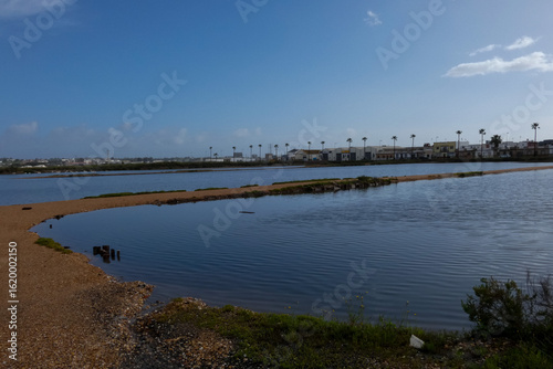 Wallpaper Mural Salt marshes reflecting the blue sky near the city of faro in portugal Torontodigital.ca