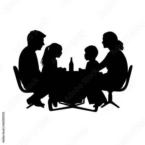 Family dinner silhouette showing parents and two children seated around table. Family enjoys meal together at home.