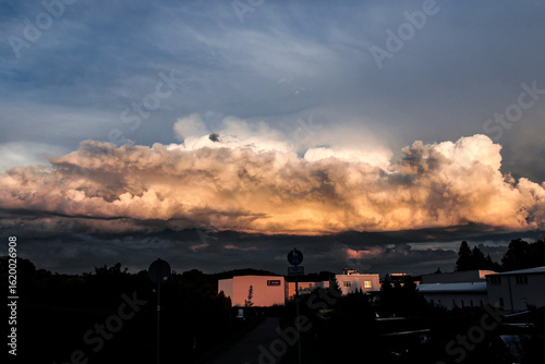 sunset in the city with storm clouds