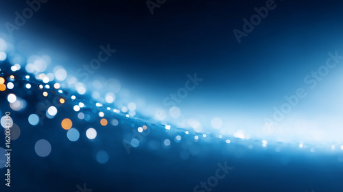 Abstract blue background with glowing light rays and star-like patterns creating a dynamic, colorful space animation