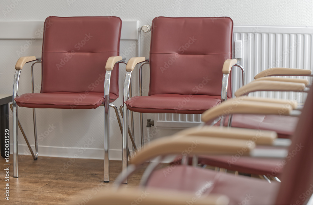 Fototapeta premium Empty Red Chairs in a Waiting Room