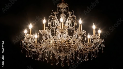 Elegant crystal chandelier against black background