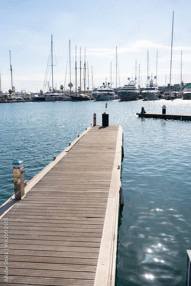 Fototapeta premium View of yachts moored in a small coastal town on the shores of the Mediterranean sea