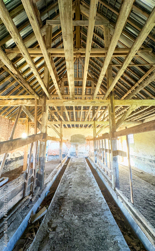 Fototapeta premium A breathtaking and stunning view of an old barns interior, showcasing the beauty of weathered wood and rustic charm