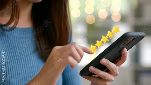 Woman using phone with positive reviews
