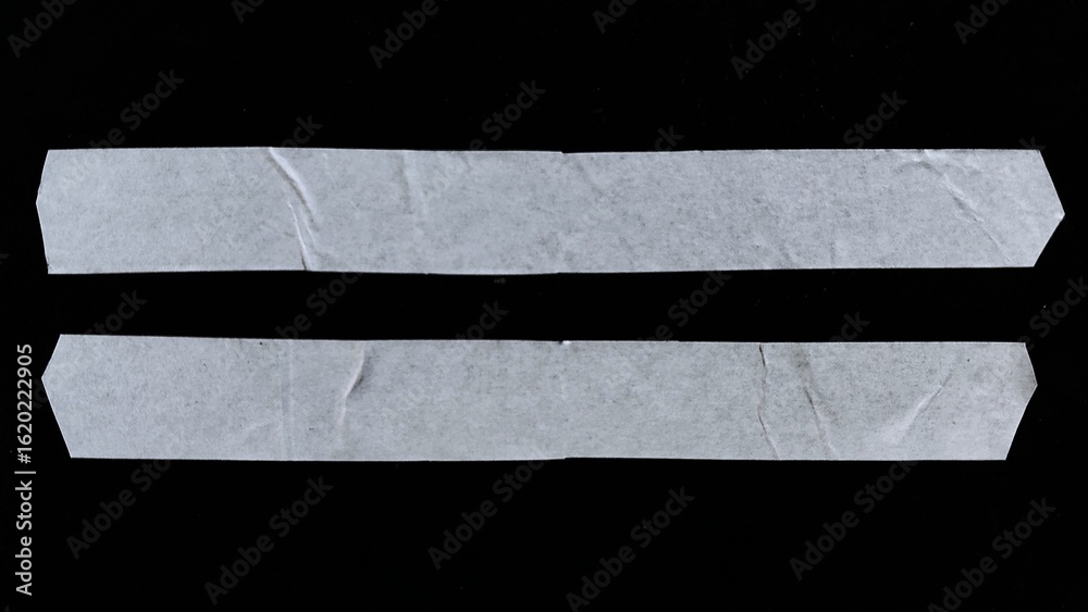 Fototapeta premium A set of blank white adhesive paper tape in rectangular shape isolated on black background with clipping path. The white paper looks vintage with wavy paper texture and wavy edges.