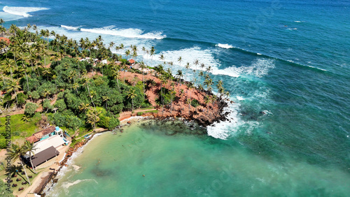 Mirissa Beach, Sri Lanka, Tropical paradise, Indian Ocean, Golden sands, Palm trees, Coconut Tree Hill, Surfing spot, Whale watching, Fishing boats, Sunset views, Aerial perspective, Secret Beach, Coa