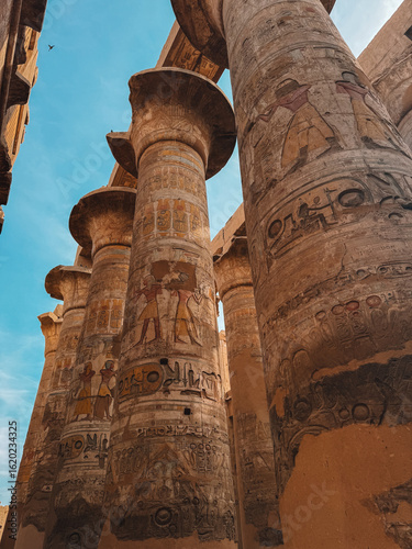 Decorated sandstone columns with hieroglyphs inside Karnak Temple, Egypt