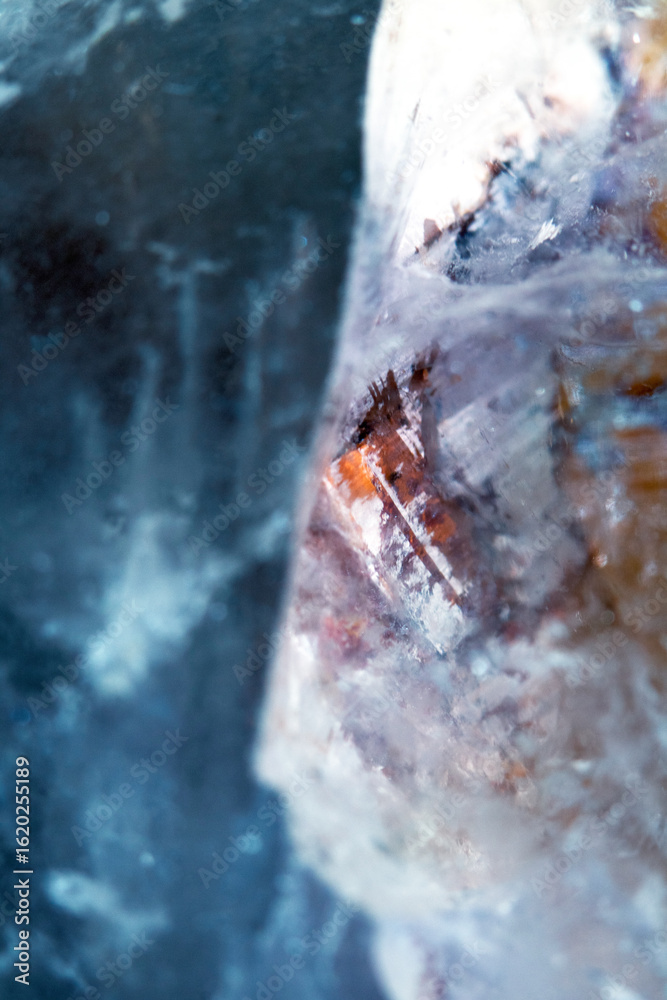 Fototapeta premium Beautiful close up of quartz crystal rock shard with reflective rainbow spiritual light