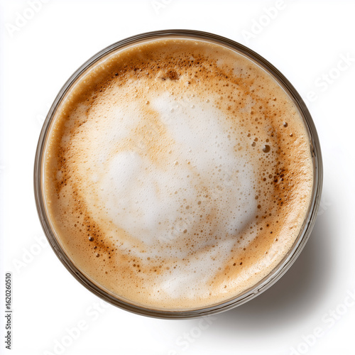 Top view of a cortado in a clear glass with foamed milk