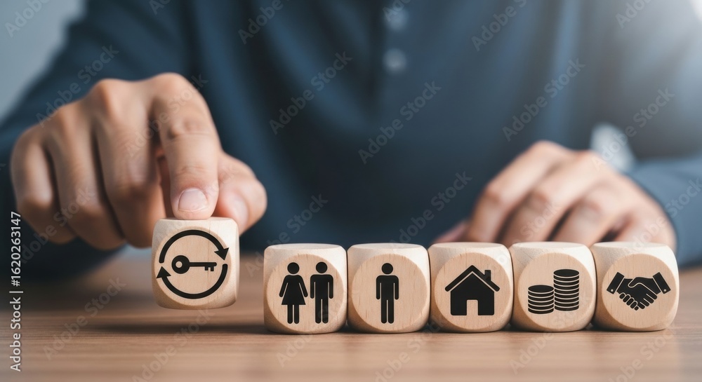 custom made wallpaper toronto digitalPersons hand arranging wooden blocks with icons representing key, family, home, business, and handshake, symbolizing life choices and success