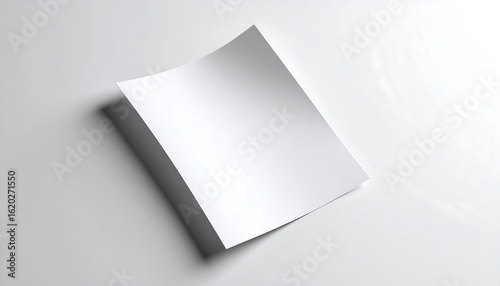 Minimalist composition of a blank white paper mockup with soft shadows, ideal for business or graphic design.