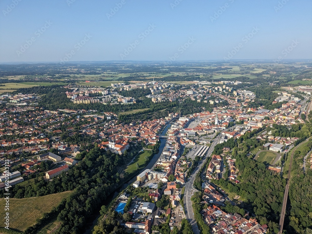 Fototapeta premium Trebic public swimming pool complex with water slides and outdoor areas aerial view