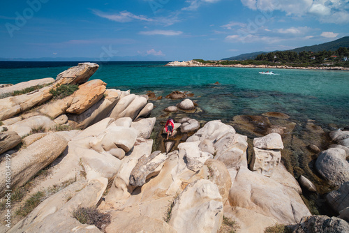 Fototapeta Naklejka Na Ścianę i Meble -  Beautiful landscape with rocky shore of the beach on the Mediterranean Sea in Greece, Travel concept.