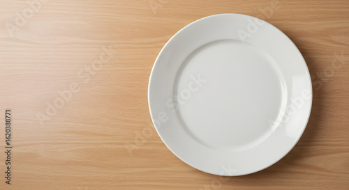 White Round Plate on Light Wooden Table, Top View