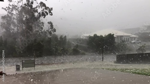View of a severe hailstorm. Extreme weather caused by climate change.
