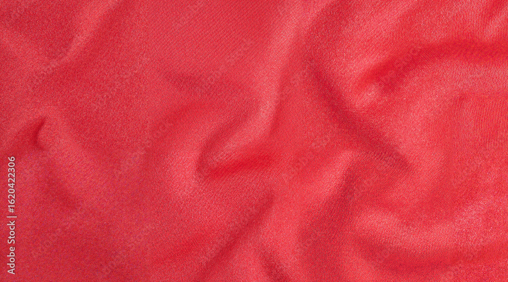 Fototapeta premium Red satin fabric with smooth texture and elegant draping 