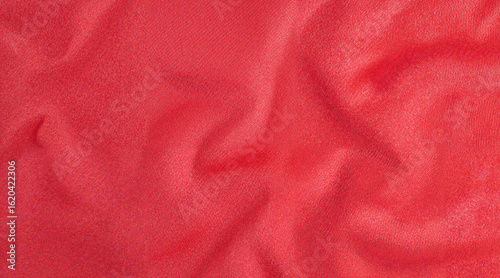 Red satin fabric with smooth texture and elegant draping  
