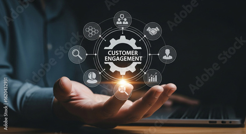 Person holding a glowing digital graphic representing customer engagement and business growth