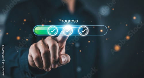 Person s finger interacting with a digital progress bar showing completion