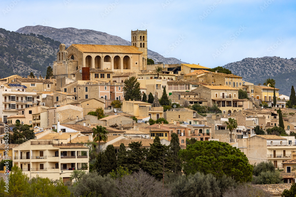 Fototapeta premium The village of Selva is located on a hill in front of the Serra de Tramuntana mountains, Majorca, Mallorca, Balearic Islands, Spain, Europe