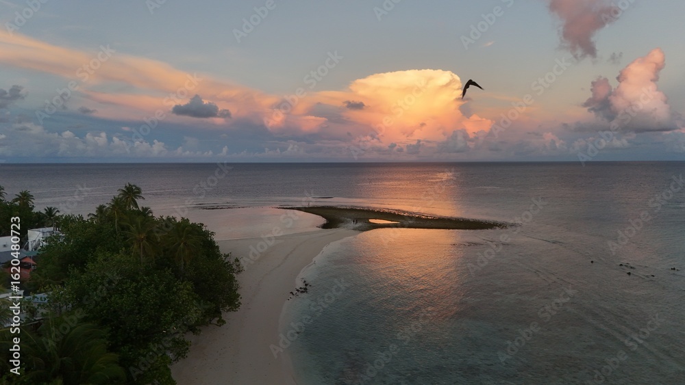 Fototapeta premium Aerial Paradise in the Maldives – Crystal Clear Water, Islands & Overwater Bungalows